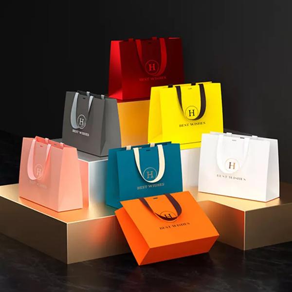 China Paper bag manufacturer Wholesale Custom Printed Logo Luxury White Paper Bag Retail Boutique Shopping Gift Paper Bags With Your Own Logo